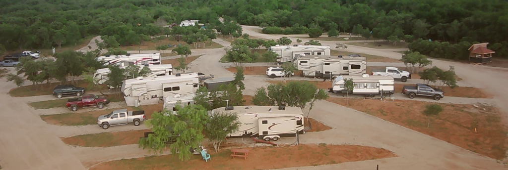 "Aerial view of Inez Spring RV Park in Eastland TX showing spring-fed pool and shaded RV sites"