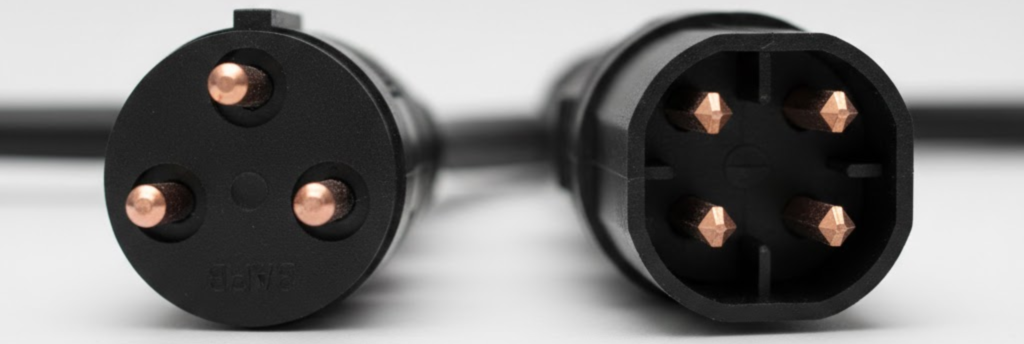 RV utility pedestal with 30-amp and 50-amp outlets, water spigot, and sewer connection at Texas campsite